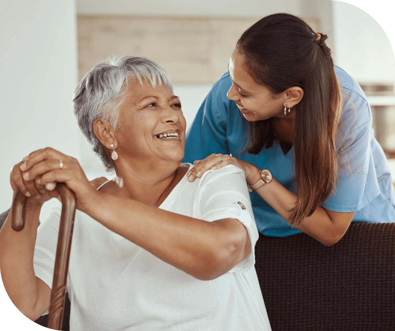 Smiling senior woman with caregiver.